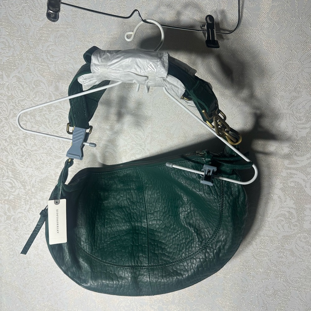Anthropologie green leather shoulder bag with gold Accents adjustable straps